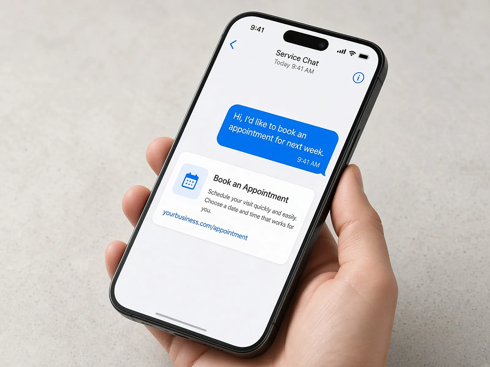 A phone showing a text message with a link to book an appointment